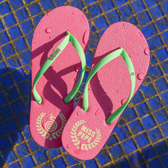 Lightweight women’s beach flip flops with red PE sole