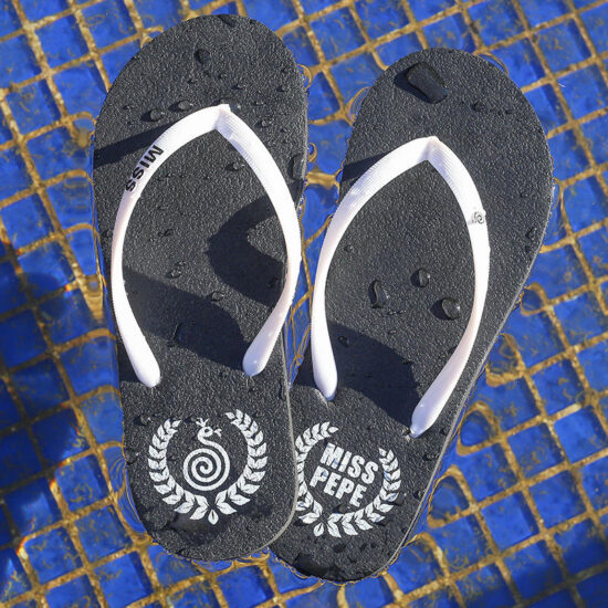 Lightweight women’s beach flip flops with red PE sole
