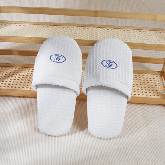 white terry hotel slippers
